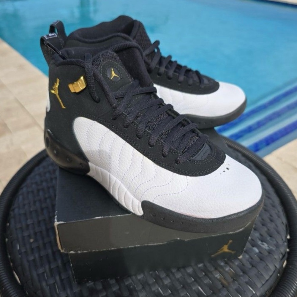 Jordan Youth Black, White, and Gold Sneakers